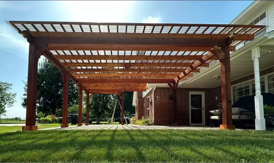 Draw inspiration from this pergola that lets sun's rays though and keeps bad weather away